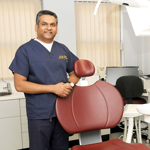 Dentist leaning on chair